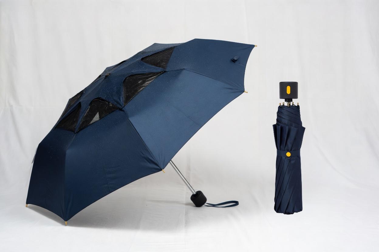 A broken wet umbrella lying in a puddle on rainy pavement, surrounded by autumn leaves.